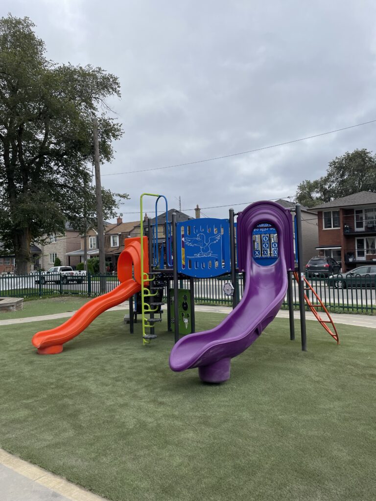 Colorful playground with slides and climbing frame.
