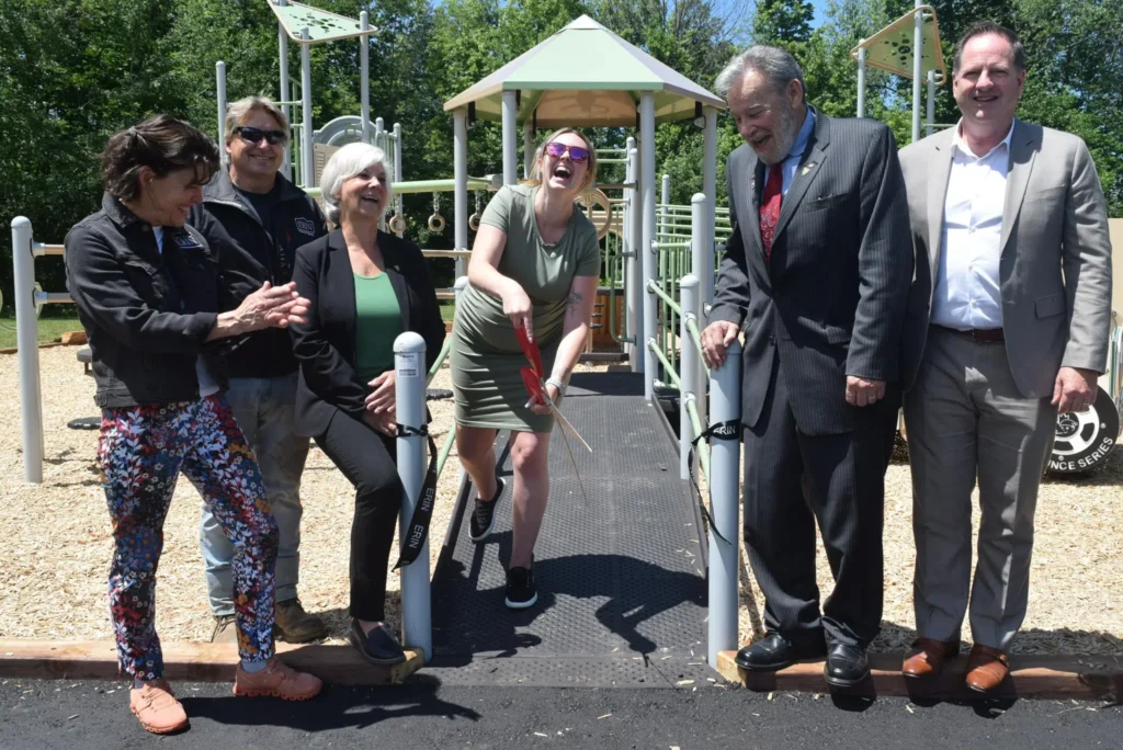 Ribbon cutting at inclusive playground opening.