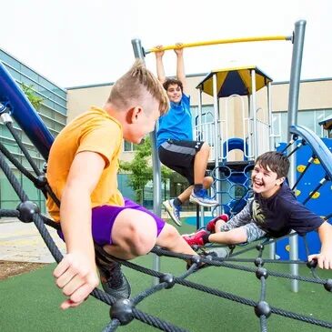W A group of kids playing on an outdoor playground.